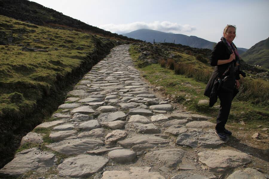 The Llanberis Path winding towards the Yr Wyddfa (Snowdon) summit, surrounded by rocky peaks.