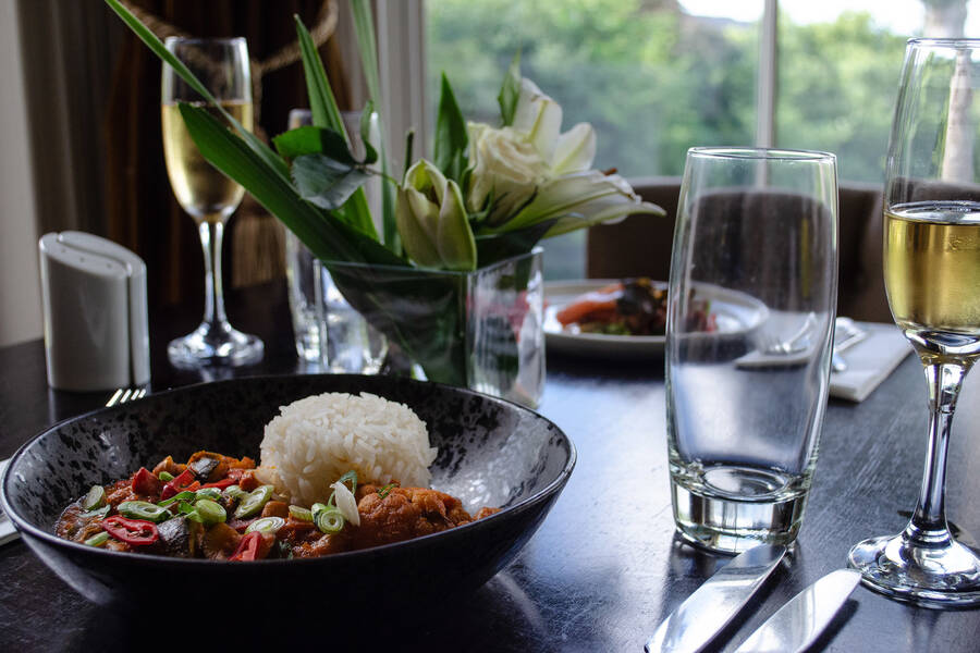 The Padarn Restaurant at the Royal Victoria Hotel Llanberis set for dinner service with elegant table settings.