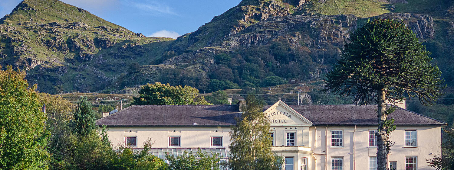 A view of the Royal Victoria Hotel in Snowdonia from afar