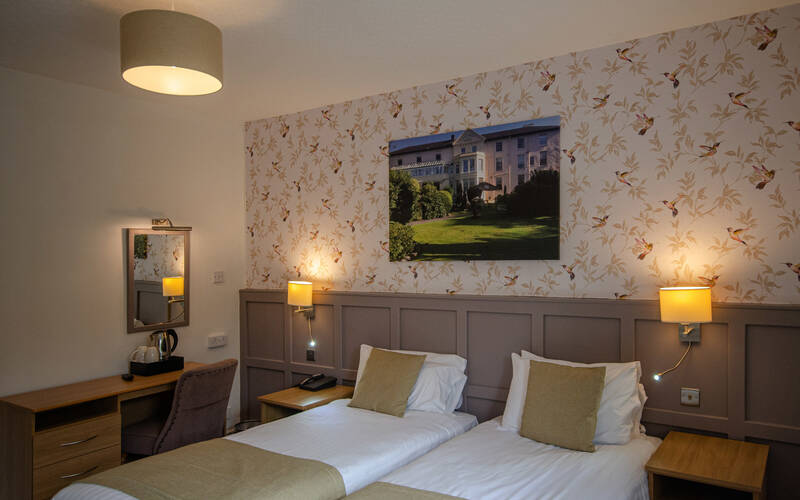 Twin or double bedroom inside the Coach House at The Royal Victoria Hotel Llanberis, furnished for comfort and relaxation.